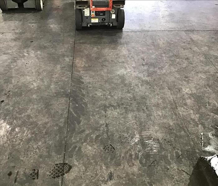 Soot covered concrete floor