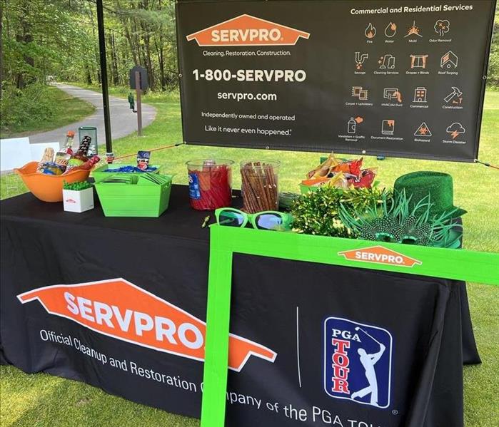 SERVPRO tent and table display on golf course