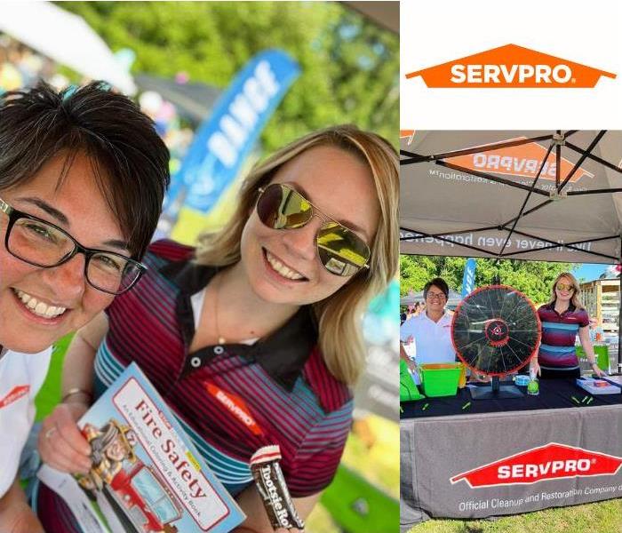 SERVPRO reps under tent display showing giveaways