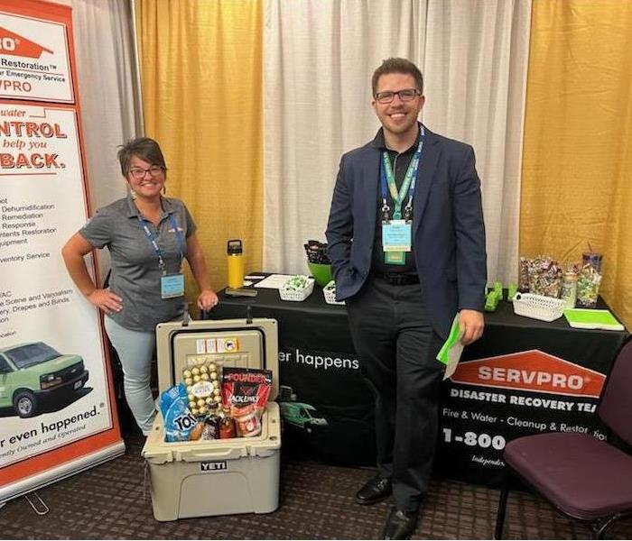 SERVPRO reps standing in front of display table