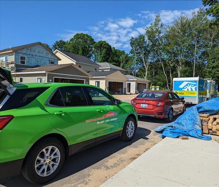 SERVPRO car in front of Habitat for Humanity homes being built